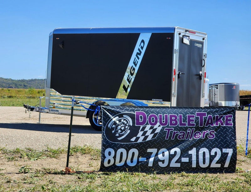 Trailer-and-sign picture of trailers on the lot at DoubleTake Trailers in Pacific Junction
